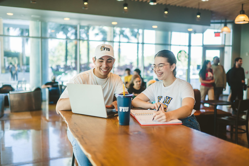 Online students in Starbucks studying