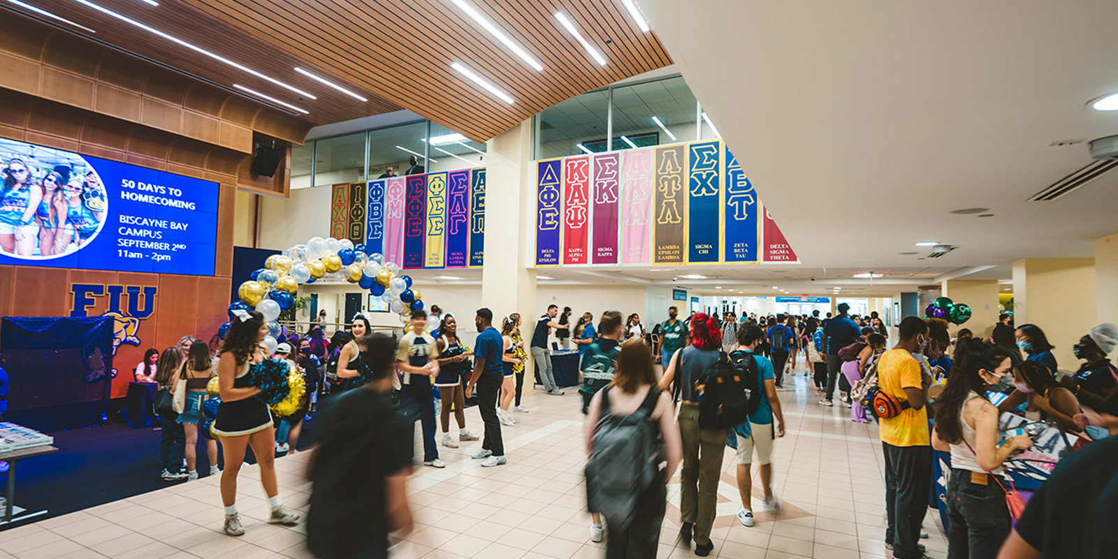 A group of students walking through building