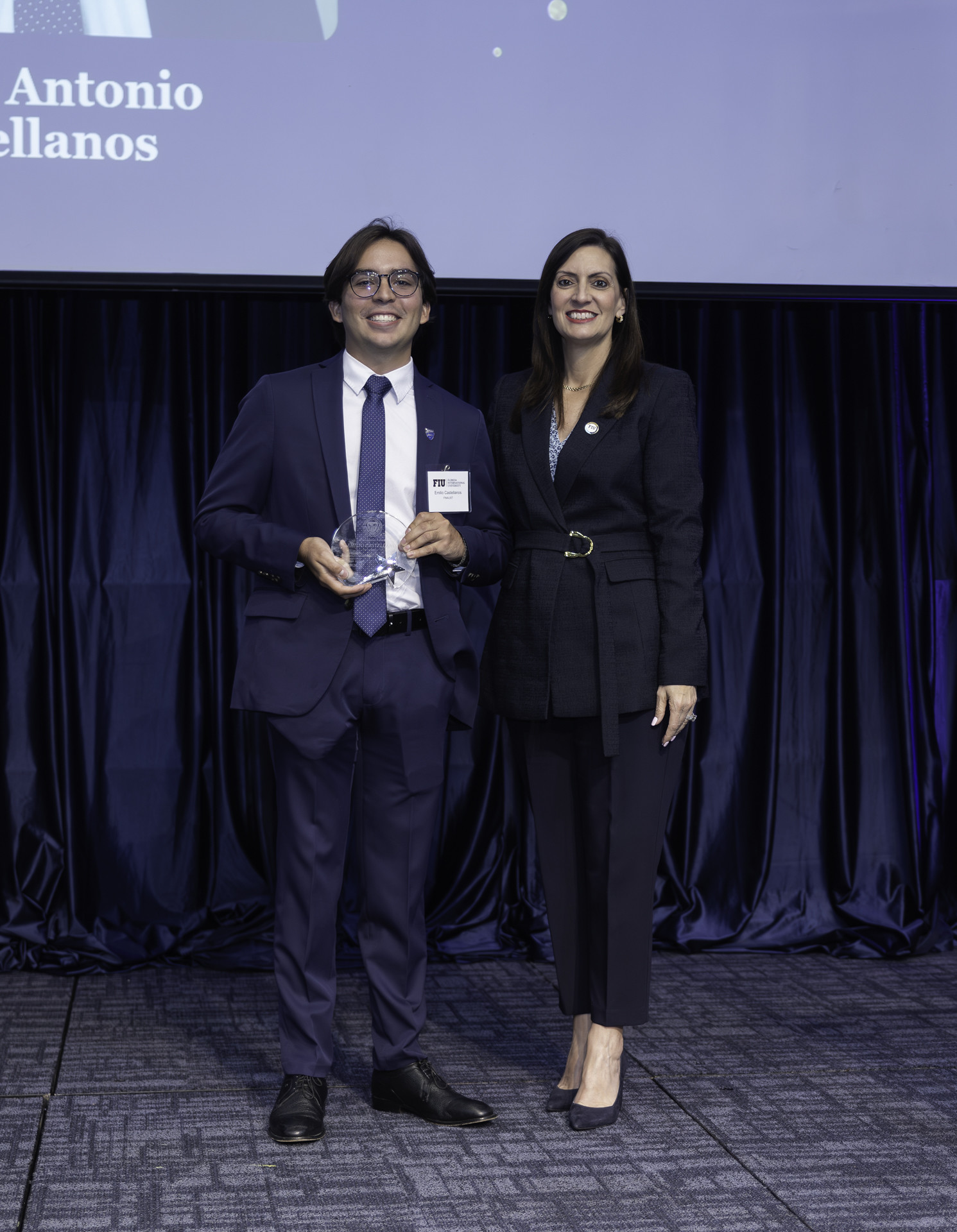 Picture of FIU President and the Winner of the Presidential Award